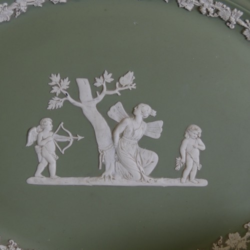 249 - A large quantity of Wedgwood green Jasperware, including pedestal bowl, trinket boxes, vases, etc., ... 