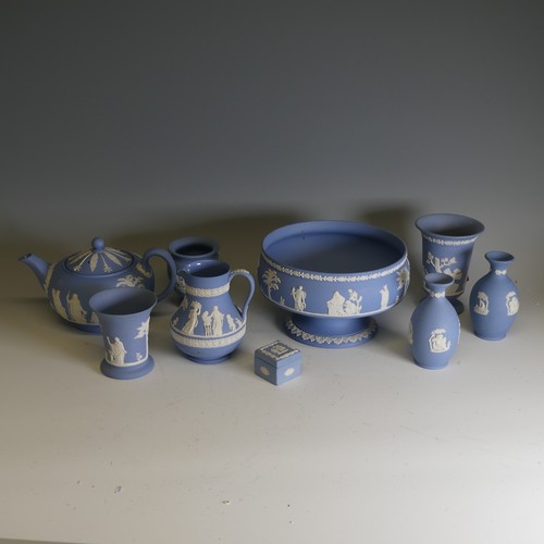 251 - A large quantity of Wedgwood blue Jasperware, including pedestal bowl, 20cm rim diameter, teapot, va... 