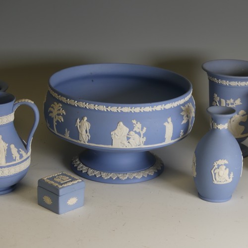 251 - A large quantity of Wedgwood blue Jasperware, including pedestal bowl, 20cm rim diameter, teapot, va... 