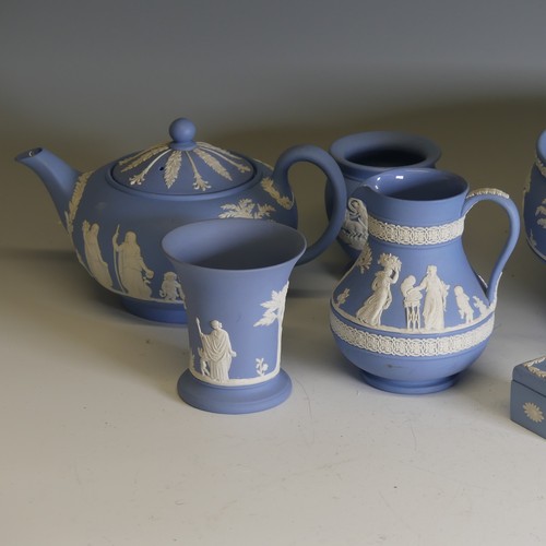 251 - A large quantity of Wedgwood blue Jasperware, including pedestal bowl, 20cm rim diameter, teapot, va... 