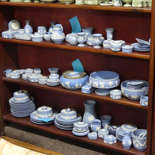 251 - A large quantity of Wedgwood blue Jasperware, including pedestal bowl, 20cm rim diameter, teapot, va... 