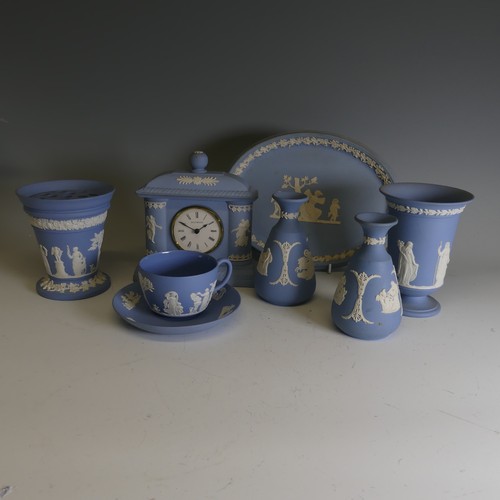 252 - A good and large quantity of Wedgwood blue Jasperware, including vases, trinket dishes and pin dishe... 