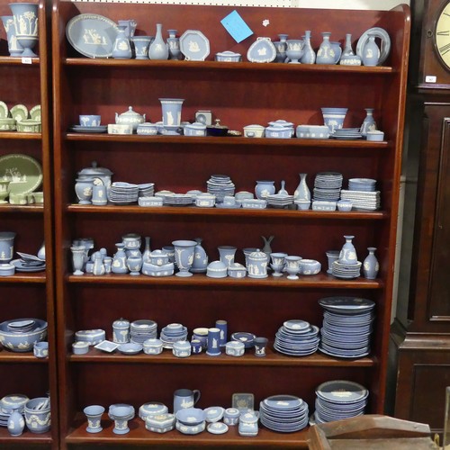 252 - A good and large quantity of Wedgwood blue Jasperware, including vases, trinket dishes and pin dishe... 