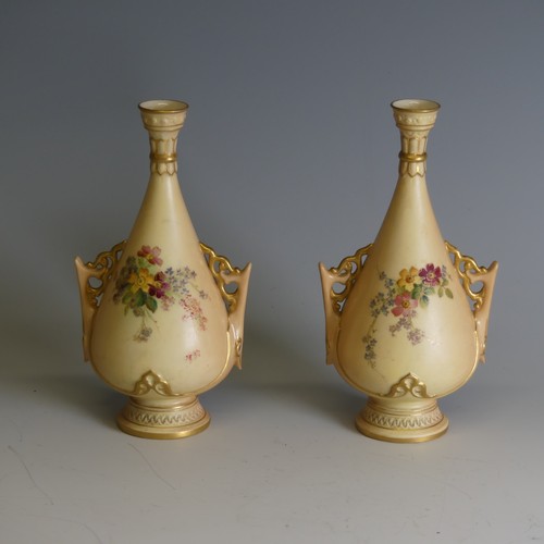 259 - A pair of Royal Worcester blush ivory Posy Vases, decorated with floral motifs, numbered 695, H 17cm... 