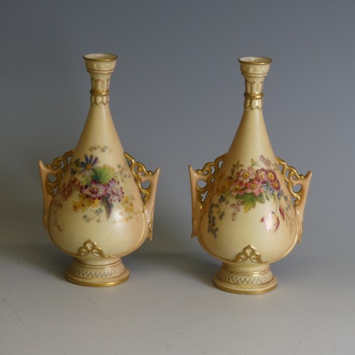 259 - A pair of Royal Worcester blush ivory Posy Vases, decorated with floral motifs, numbered 695, H 17cm... 