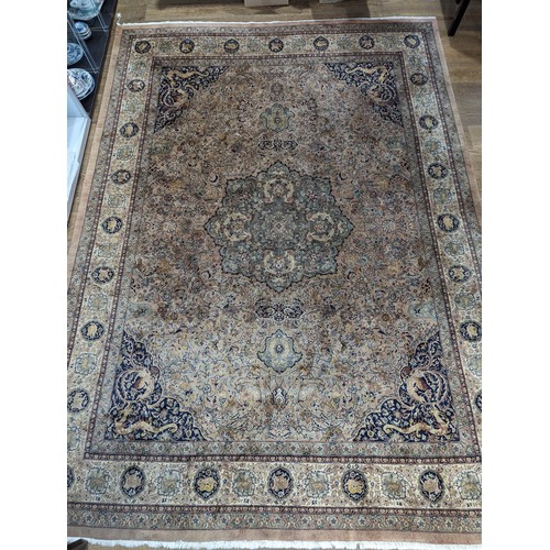 347 - Tribal Rugs; a fine hand-knotted Persian Isfahan rug, wool pile on cotton base, buff ground woven wi... 