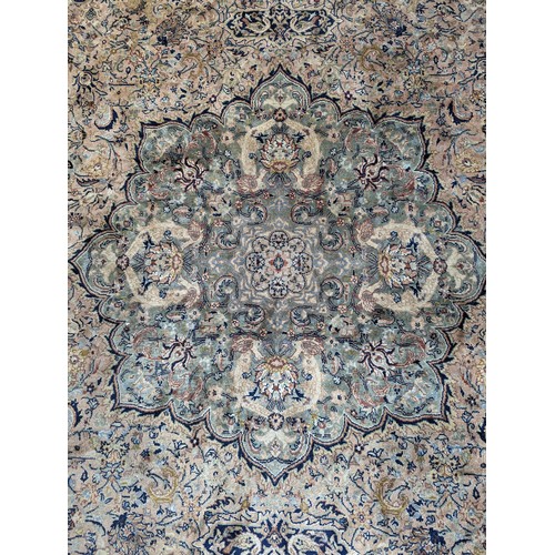 347 - Tribal Rugs; a fine hand-knotted Persian Isfahan rug, wool pile on cotton base, buff ground woven wi... 