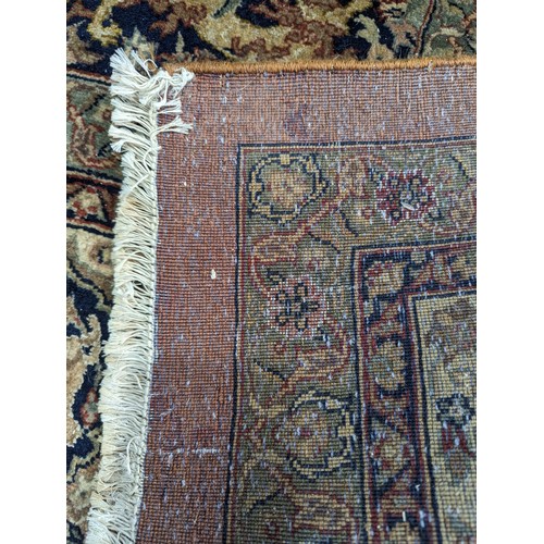 347 - Tribal Rugs; a fine hand-knotted Persian Isfahan rug, wool pile on cotton base, buff ground woven wi... 