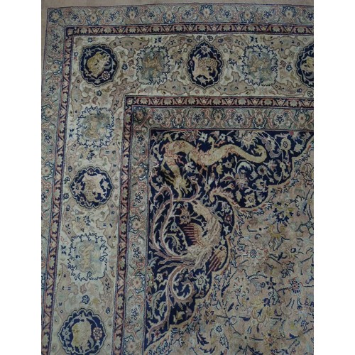 347 - Tribal Rugs; a fine hand-knotted Persian Isfahan rug, wool pile on cotton base, buff ground woven wi... 