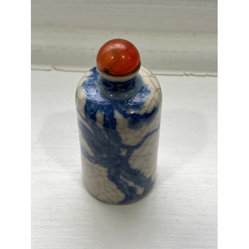 189 - A Chinese porcelain blue and white crackleware Snuff Bottle, of shouldered tapering conical form, un... 