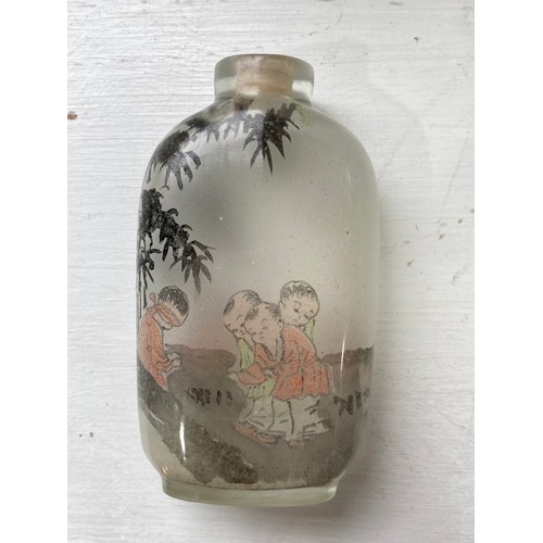 188 - A 19thC Chinese milk glass enamelled Snuff Bottle, enamelled with a fisherman with animals under a t... 