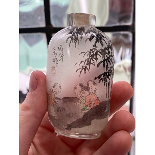 188 - A 19thC Chinese milk glass enamelled Snuff Bottle, enamelled with a fisherman with animals under a t... 