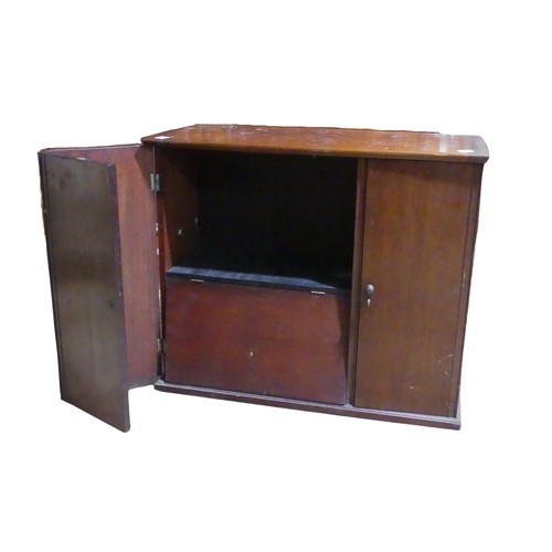 417 - An antique mahogany storage Cabinet, hinged top over three doors concealing varying compartments, br... 