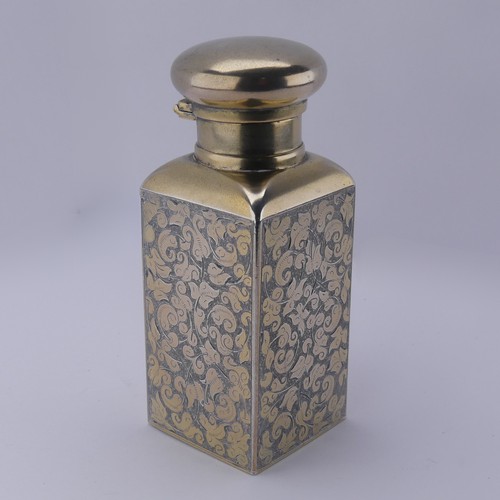 Sampson Mordan; A Victorian silver gilt Scent Bottle, hallmarked London 1883, of rectangular form with foliate decoration, plain circular hinged cover and glass stopper, 8.3cm high, 5.3ozt.