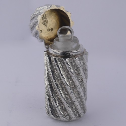 10 - Sampson Mordan; A Victorian silver Scent Bottle, hallmarked London 1882, with engraved swirl fl... 