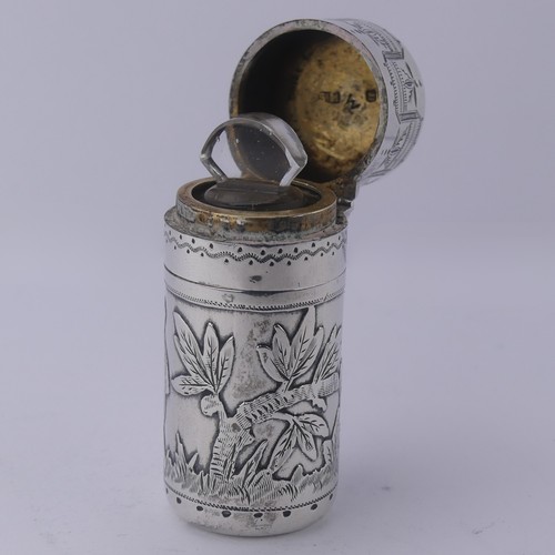 11 - Sampson Mordan; A Victorian silver Scent Bottle, hallmarked London 1881, decorated with a boy t... 