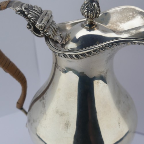 15 - An Edwardian silver Hot Water Jug, by Charles Stuart Harris, hallmarked London 1903, of baluster for... 