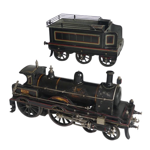 Rare Schoenner gauge 3, live steam, Black Prince 4-4-0 locomotive and six wheel tender, circa 1905, the live steam, spirit fired engine No.1502, with water gauge glass, whistle, forward/reverse lever, external cylinders operating drive wheels, apparently original five wick burner, boiler safety valve, dome, chimney, hand-rail and three lamps; the six-wheel tender with hinged boxes to top, all finished in original LNWR lined black livery, length of engine 34.5cm, length of tender 21cm, together with a wooden carry box (possibly original), overall good condition, some paint loss to locomotive and tender, some paint scorching to boiler.