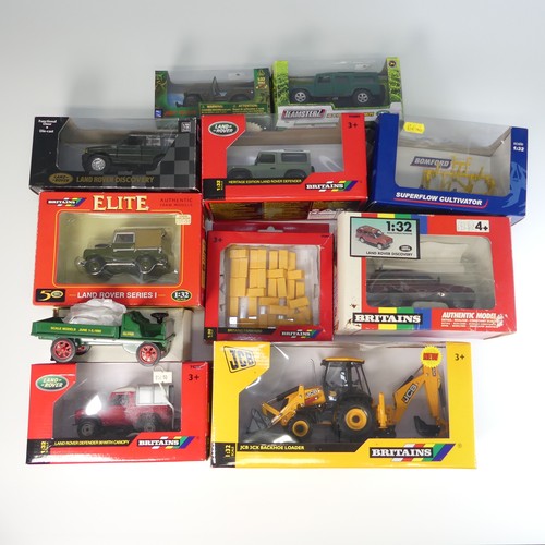 128 - A collection of various boxed farm vehicles, including an Oliver factory truck, 4 Britains 1:32 scal... 