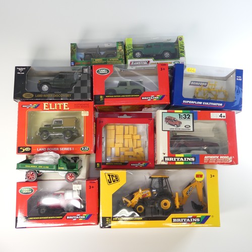 128 - A collection of various boxed farm vehicles, including an Oliver factory truck, 4 Britains 1:32 scal... 