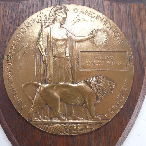 222 - A WW1 Devonshire memorial Plaque 'Death Penny', awarded to the family of 'William Ernest Wynn', moun... 