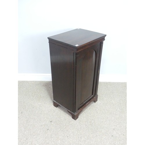 438 - An antique mahogany Pot Cupboard, squared top over cupboard door concealing two shelves, raised on b... 