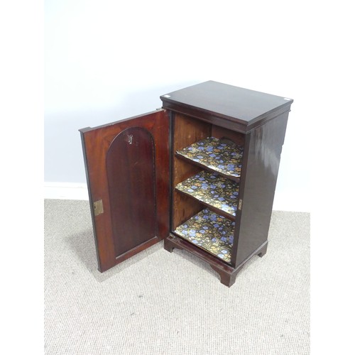 438 - An antique mahogany Pot Cupboard, squared top over cupboard door concealing two shelves, raised on b... 