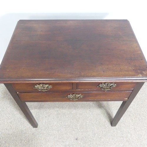 439 - A Georgian oak Lowboy, shaped top over three drawers and square canted legs, W 75.5 cm x H 71 cm x D... 