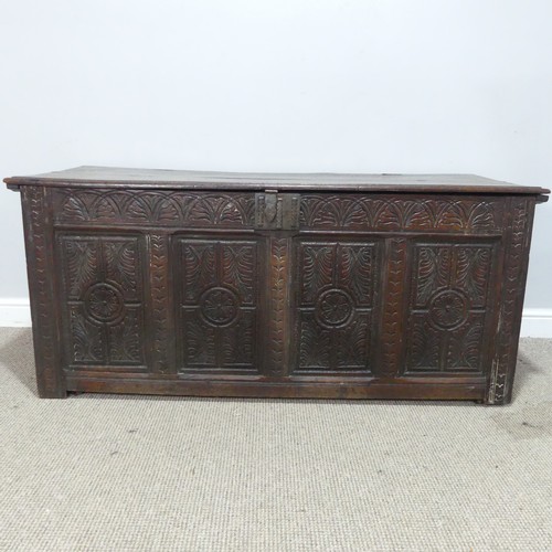 457 - A 17th century and later oak Coffer, rectangular plank top over 17th century carved panels, raised o... 