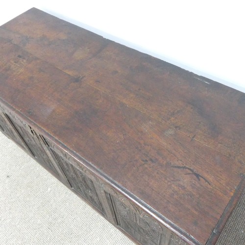 457 - A 17th century and later oak Coffer, rectangular plank top over 17th century carved panels, raised o... 