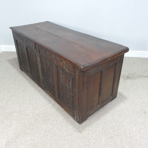 457 - A 17th century and later oak Coffer, rectangular plank top over 17th century carved panels, raised o... 