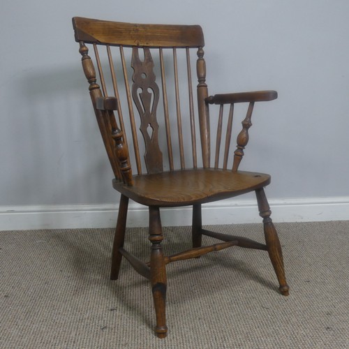 465 - An antique ash and elm windsor Armchair, legs cuts down and with old metal repairs, W 57 cm x H 85 c... 