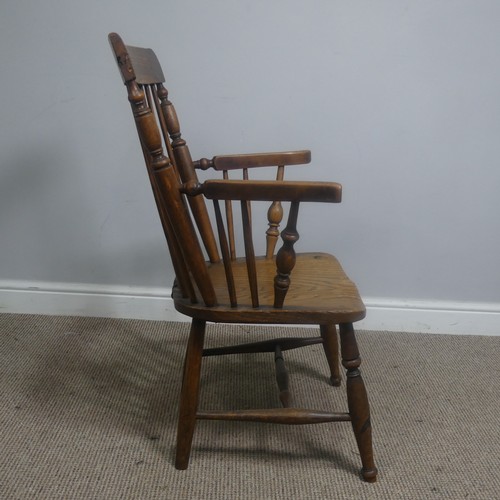 465 - An antique ash and elm windsor Armchair, legs cuts down and with old metal repairs, W 57 cm x H 85 c... 