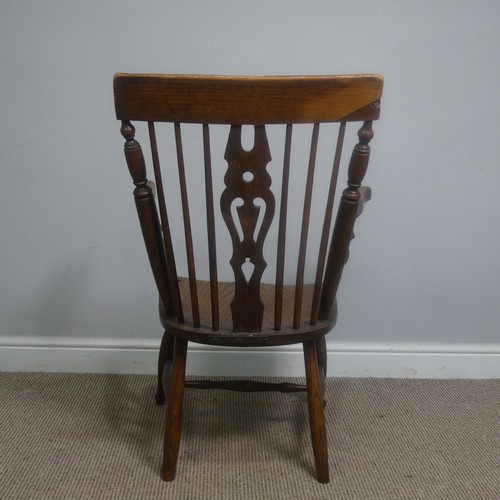 465 - An antique ash and elm windsor Armchair, legs cuts down and with old metal repairs, W 57 cm x H 85 c... 