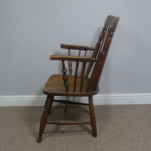 465 - An antique ash and elm windsor Armchair, legs cuts down and with old metal repairs, W 57 cm x H 85 c... 