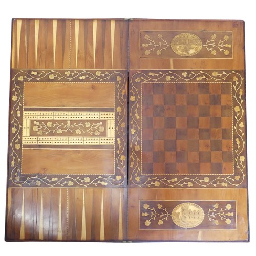 467 - A 19th century Irish Killarney marquetry and yew games Table, hinged rectangular top inlaid with an ... 