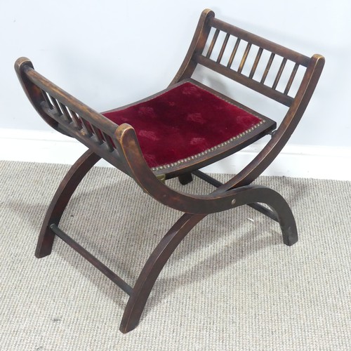 475 - An antique Ecclesiastical Savonarola folding Stool, the seat upholstered with embossed red velvet, W... 