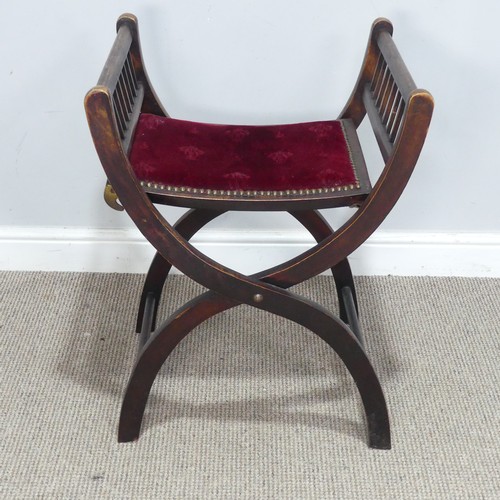 475 - An antique Ecclesiastical Savonarola folding Stool, the seat upholstered with embossed red velvet, W... 