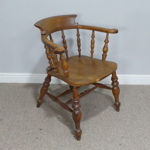 480 - An early 20th century ash and elm Captains / Smokers Bow Armchair, W 66 cm x H 77 cm x D 60 cm.... 