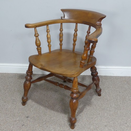 480 - An early 20th century ash and elm Captains / Smokers Bow Armchair, W 66 cm x H 77 cm x D 60 cm.... 