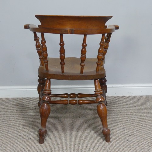 480 - An early 20th century ash and elm Captains / Smokers Bow Armchair, W 66 cm x H 77 cm x D 60 cm.... 