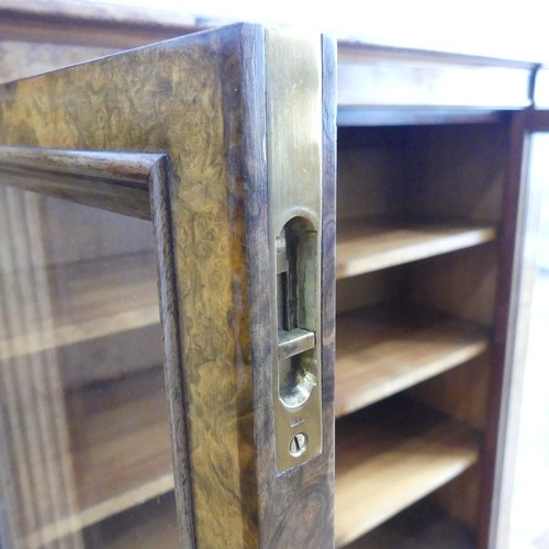 494 - A good Victorian burr walnut breakfront glazed Bookcase, shaped top over glazed doors and plinth bas... 