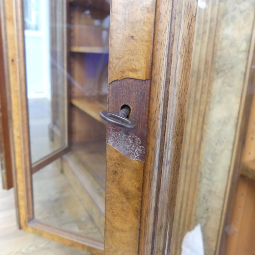 494 - A good Victorian burr walnut breakfront glazed Bookcase, shaped top over glazed doors and plinth bas... 