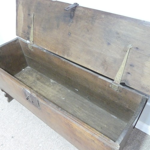 498 - An 18th century oak Coffer, rectangular top with replacement hinges, raised on end supports, W 131 c... 