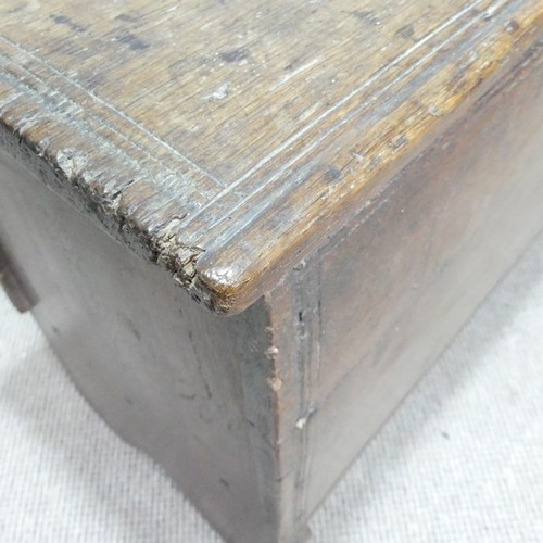 498 - An 18th century oak Coffer, rectangular top with replacement hinges, raised on end supports, W 131 c... 