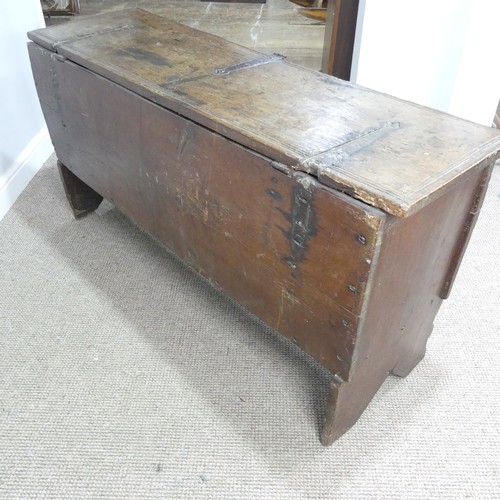 498 - An 18th century oak Coffer, rectangular top with replacement hinges, raised on end supports, W 131 c... 