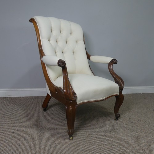 563 - A Victorian mahogany open Armchair, upholstered button back and scroll arms, above serpentine front ... 