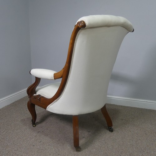 563 - A Victorian mahogany open Armchair, upholstered button back and scroll arms, above serpentine front ... 