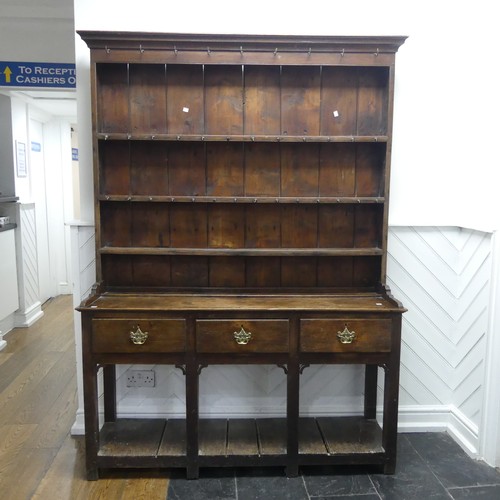 503 - A George III oak Dresser with plate rack, moulded cornice over frieze with hooks, above three panel ... 