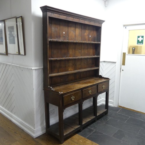 503 - A George III oak Dresser with plate rack, moulded cornice over frieze with hooks, above three panel ... 